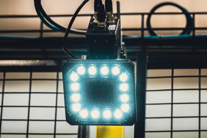 Machine vision optical sensor on manufacturing automation cell.